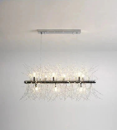 Modern rectangular chandelier with metallic base, clear glass bulbs, and sparkling crystal branch accents.