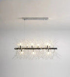 Modern rectangular chandelier with metallic base, clear glass bulbs, and sparkling crystal branch accents.