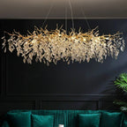Modern Crystal LED Chandelier by Maison Ornate with polished aluminum frame and crystal leaf accents.