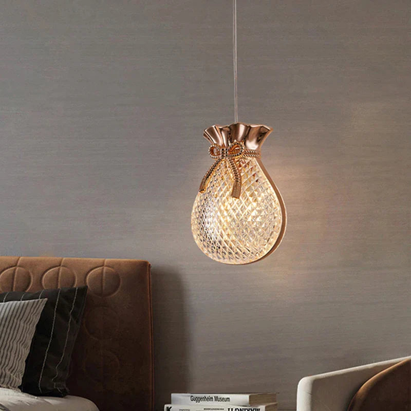 Maison Ornate modern crystal chandelier with gold accents, money bag-shaped, elegant and chic lighting fixture.