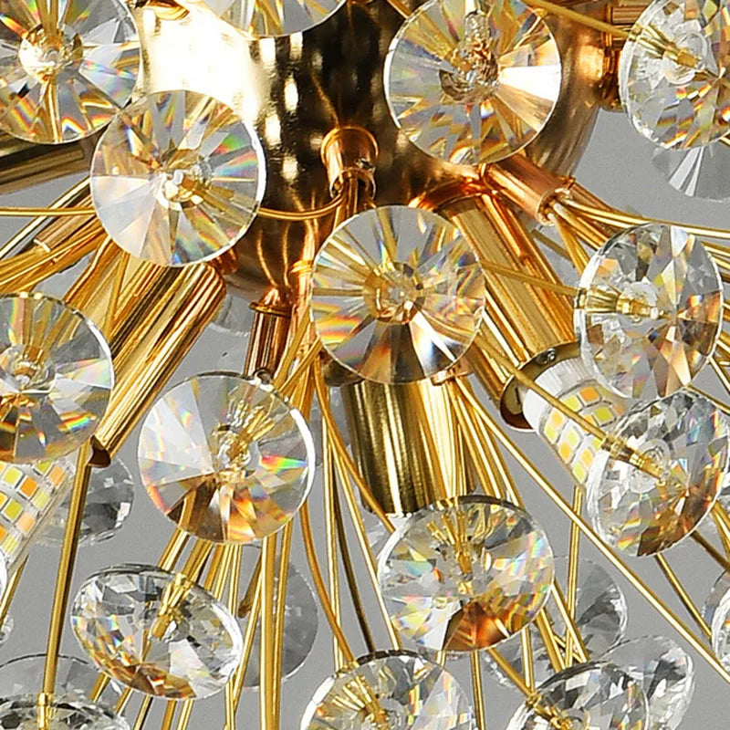 Gold rods radiate outward, each with faceted crystals reflecting rainbow light; modern Art Deco chandelier.