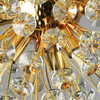 Gold rods radiate outward, each with faceted crystals reflecting rainbow light; modern Art Deco chandelier.