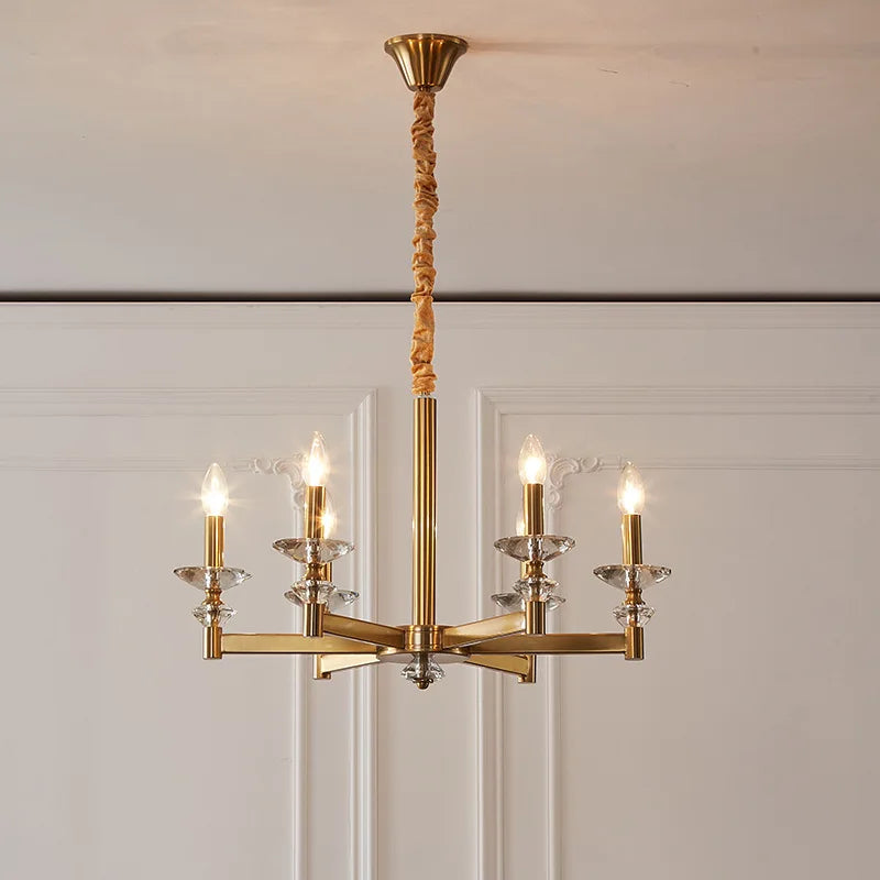 Retro industrial iron chandelier with six gold arms, clear crystals, and candle-style bulbs.