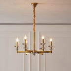 Retro industrial iron chandelier with six gold arms, clear crystals, and candle-style bulbs.