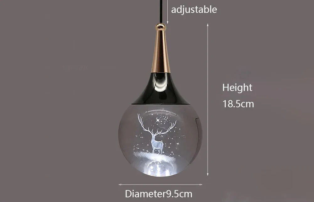 Modern LED crystal chandelier with glass orb, etched reindeer, gold and black teardrop detail.