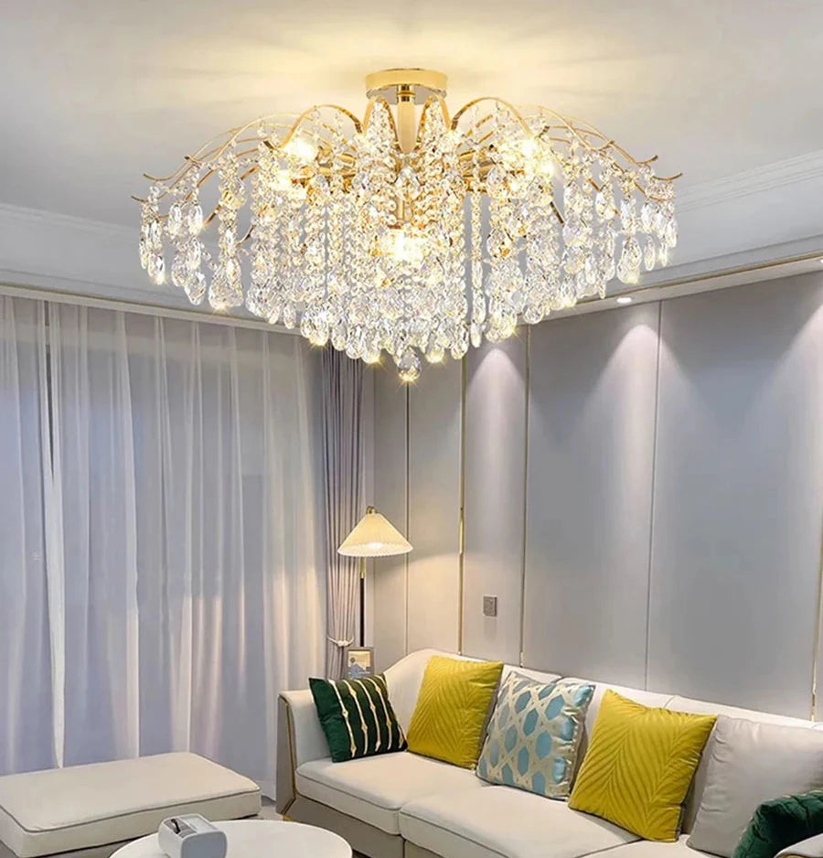 Maison Ornate Modern Crystal Chandelier features gold accents and LED lights for a luxurious, contemporary bedroom style.
