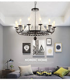 Maison Ornate Industrial Crystal Chandelier with iron and acrylic details suspended elegantly from ceiling.