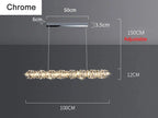 Rectangular chrome LED chandelier with dimmable crystal rings and adjustable suspension for modern interiors.