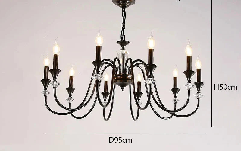 Eight-bulb vintage crystal chandelier with black metal frame, candle shapes, and sparkling accents.