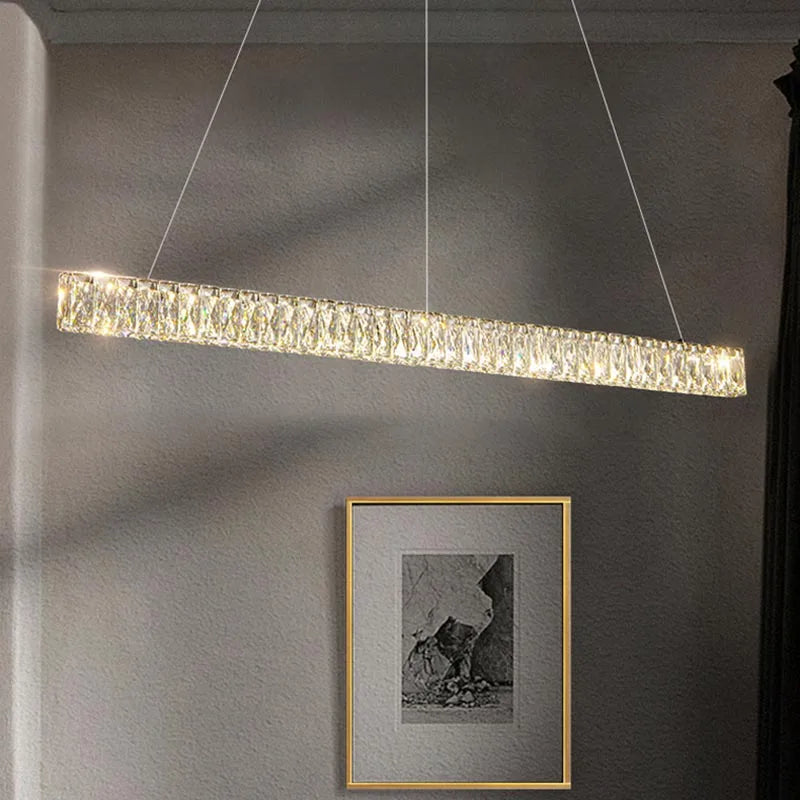 The Modern Crystal Chandelier by Maison Ornate features a sleek LED design and two slim suspension wires.