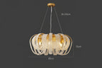 Ornate Modern Nordic chandelier with gold and crystal LED loops, round mount, adjustable height.