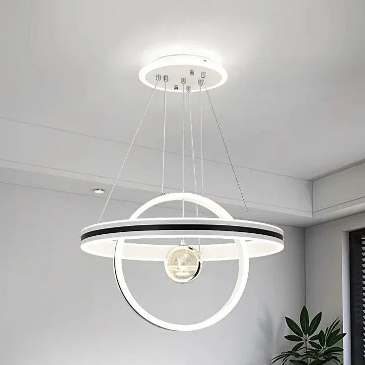Modern circular crystal chandelier with dual luminous rings and inner sphere; elegant, adjustable luxury lighting.