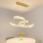 Maison Ornate postmodern crystal chandelier with two illuminated loops and stainless steel details.