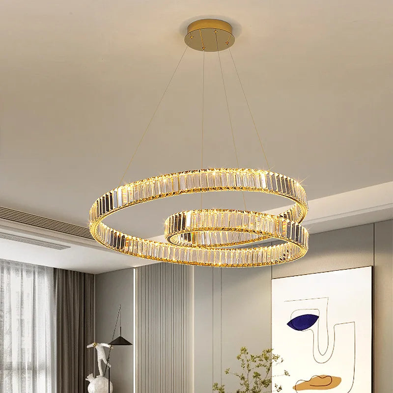 The Modern Elegant Chandelier by Maison Ornate with two gold crystal-embellished LED rings.