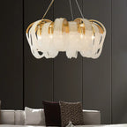Ornate modern crystal spiral chandelier with gold accents and white beaded strands, luxury ceiling light.