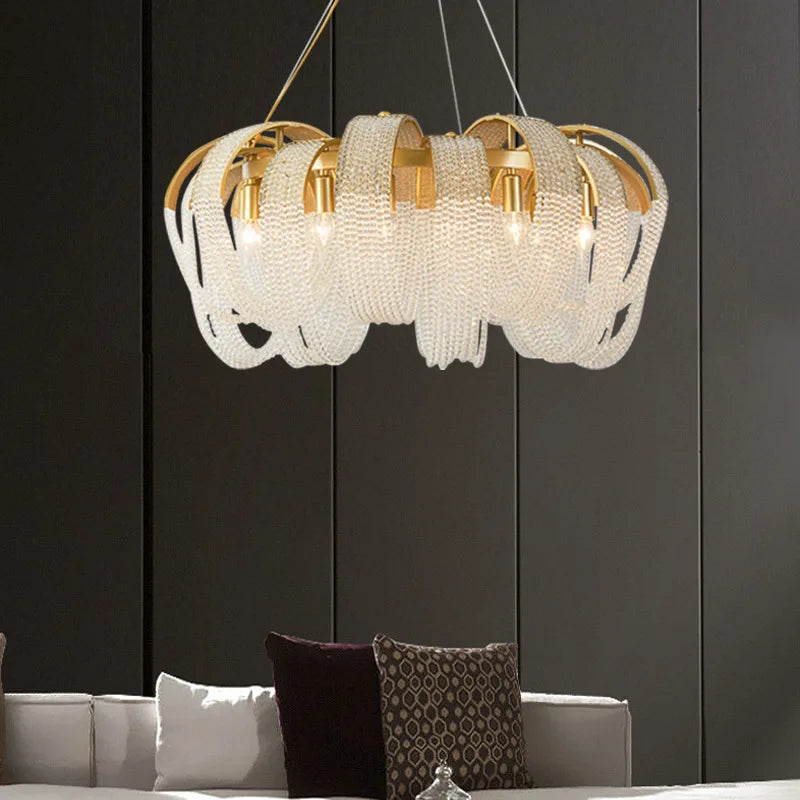 Ornate modern crystal spiral chandelier with gold accents and white beaded strands, luxury ceiling light.