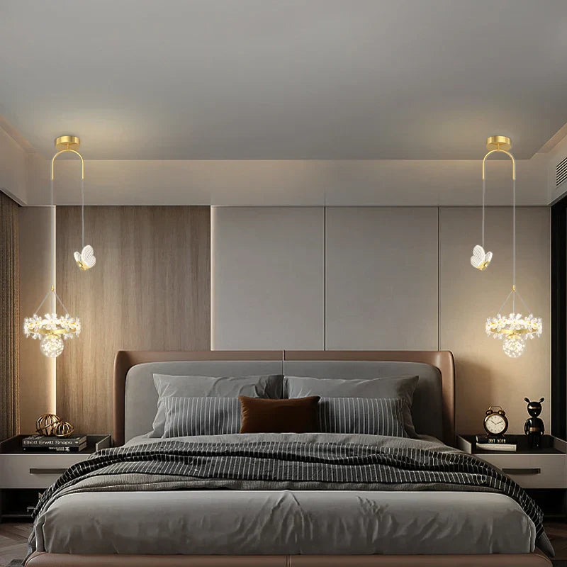 Two Maison Ornate Minimalist Single-Head Crystal Ball Pendant Lights, suspended elegantly. Modern chandelier design focus.