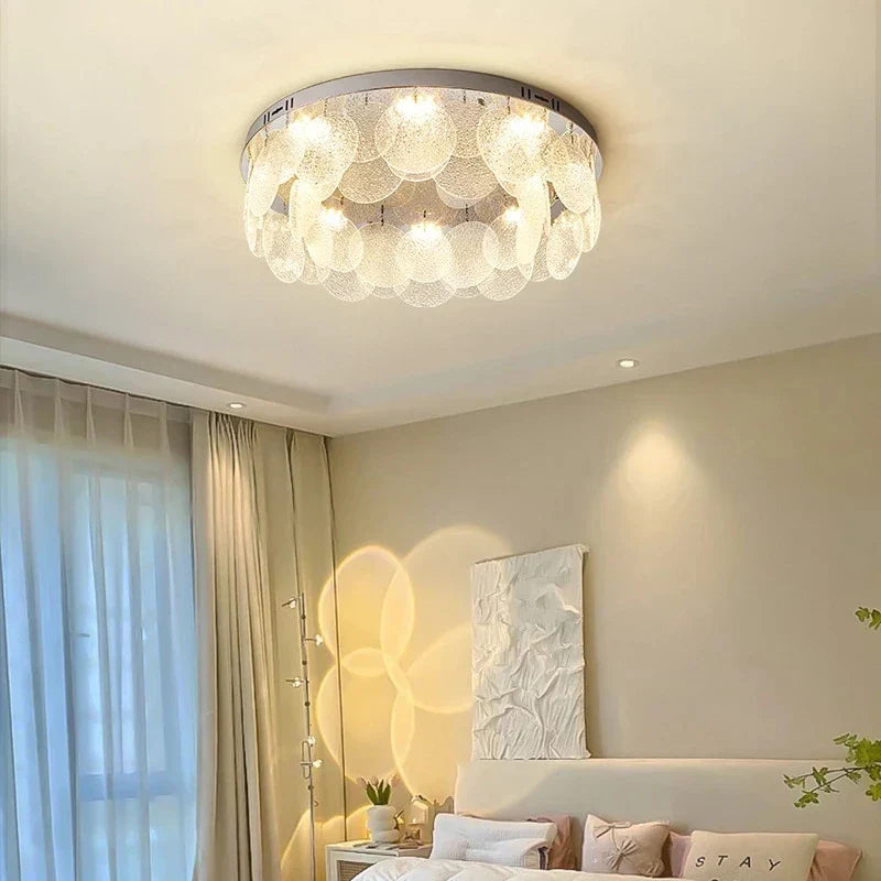 Maison Ornate Postmodern Crystal Chandelier with sparkling crystals, casting circular light patterns overhead.