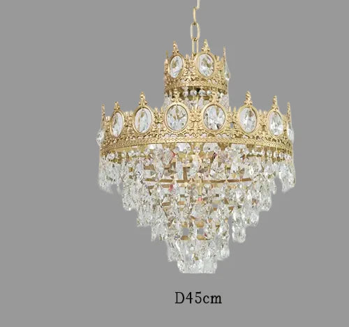 Maison Ornate Crystal Ball Chandelier with gold details, crown-like top, and clear crystal drops.