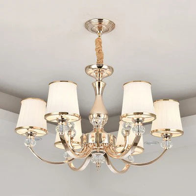 Baroque chandelier with six curved arms, white shades, gold and white finish, sparkling crystals.