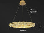 Modern crystal LED chandelier, 40cm circular shape, three adjustable wires, emits warm luxury light.