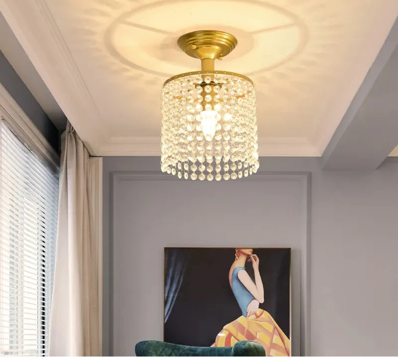 Maison Ornate Modern Glass Gold Luxury Crystal LED Chandelier with hanging beads casting decorative shadows.