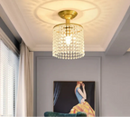 Maison Ornate Modern Glass Gold Luxury Crystal LED Chandelier with hanging beads casting decorative shadows.