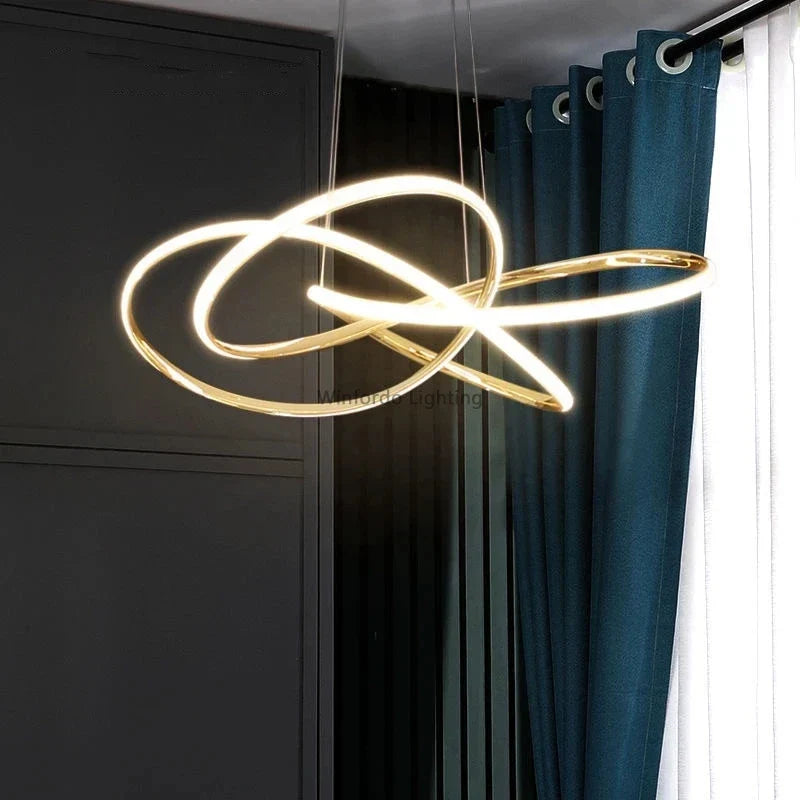 Postmodern crystal chandelier with three interlocking LED rings, elegant and sophisticated design.