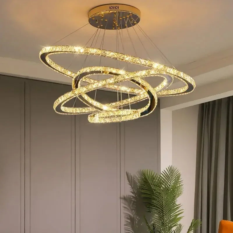 Maison Ornate Crystal Dining Room Chandelier with four gold-finished illuminated rings, elegantly radiant.