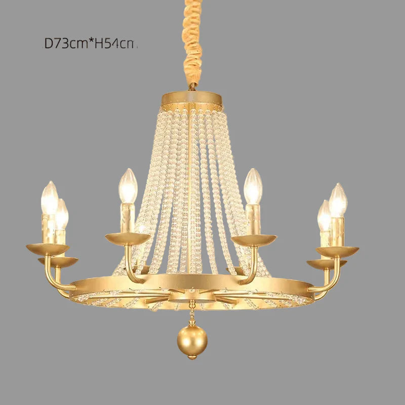 Ornate gold chandelier with six candle lights, crystal tassels, beads, and twisted chain detailing.