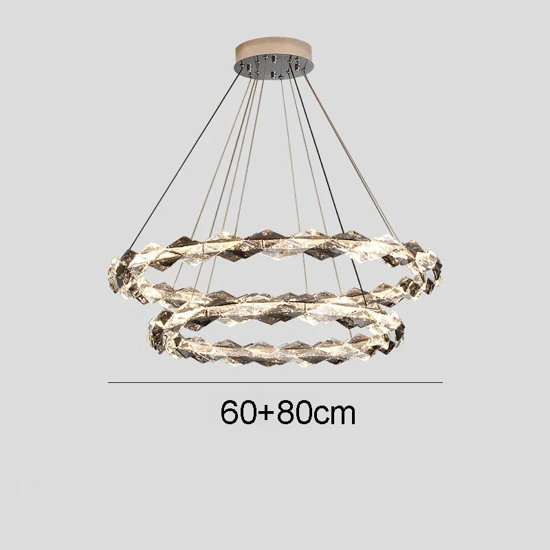 Maison Ornate chandelier with two intertwined LED rings, dimmable function, and sleek metal suspension.