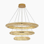 Three gold-ring chandelier with crystal accents, LED lighting, elegantly tiered and wire-suspended.