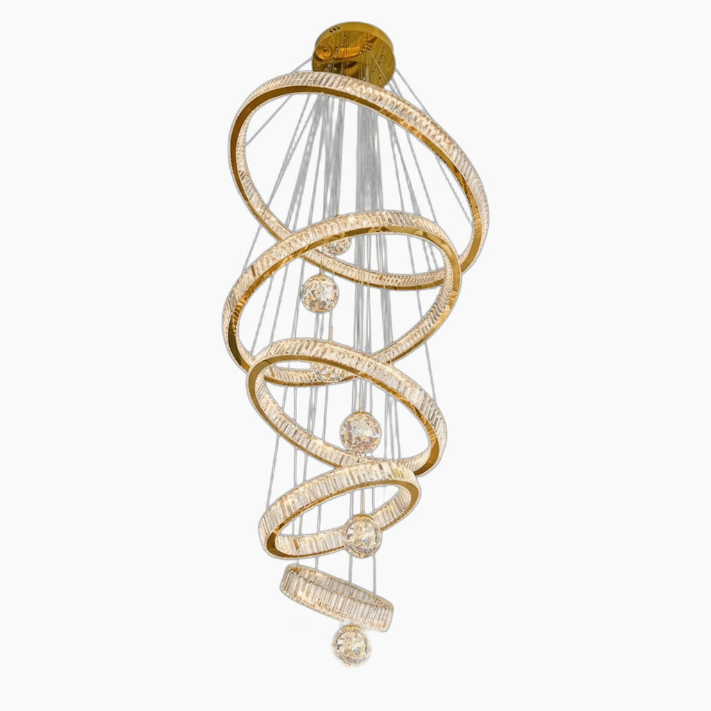 Five spiral gold LED rings, crystals, and glass orbs suspended from a circular gold chandelier.