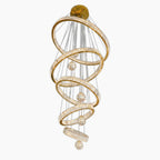 Five spiral gold LED rings, crystals, and glass orbs suspended from a circular gold chandelier.