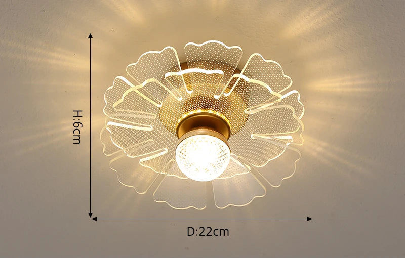 Modern crystal chandelier with flower-patterned translucent shade, gold floral accents, warm central bulb, 22 cm diameter.