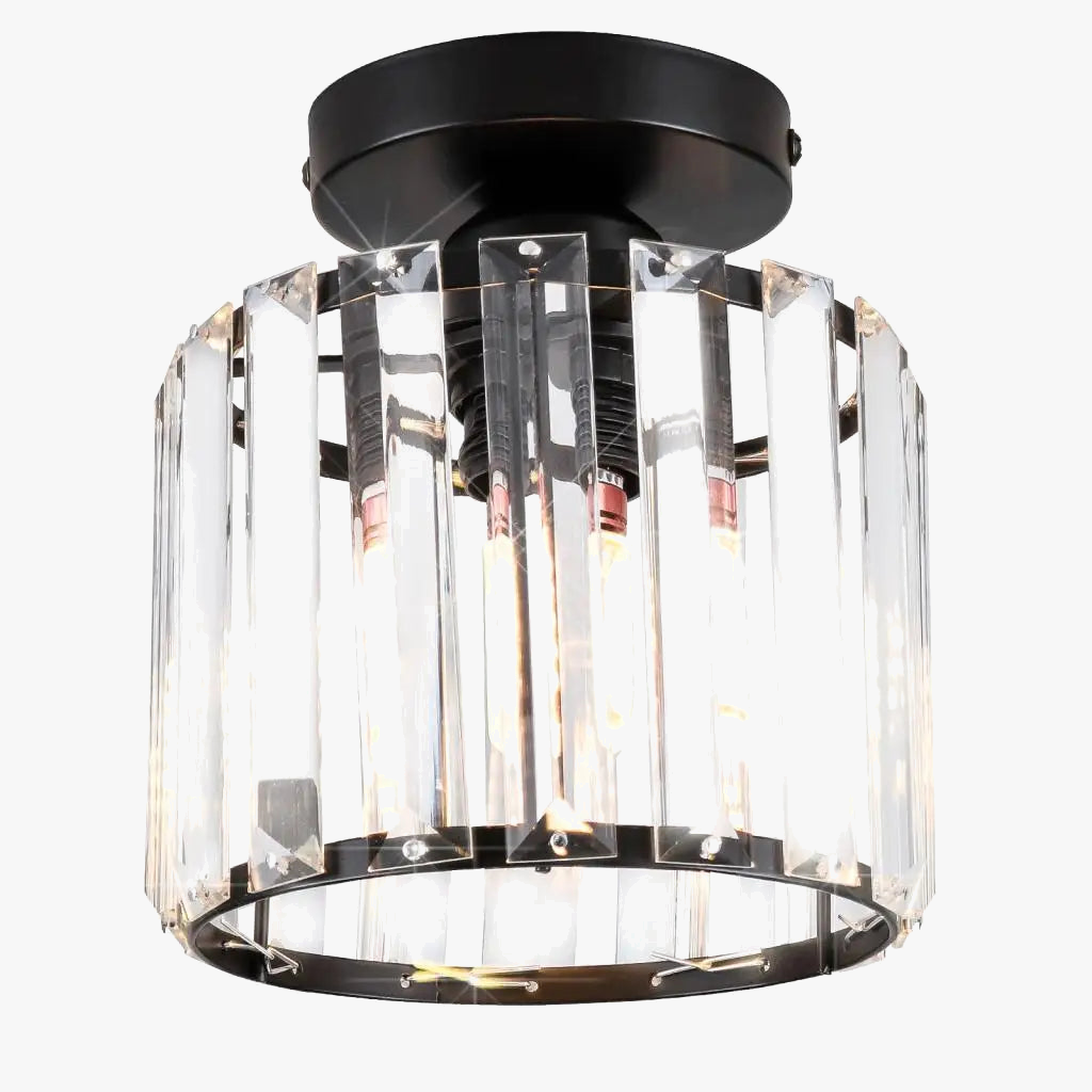 Modern industrial chandelier with round black base and vertical clear crystal panels; elegant accent.