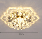 Maison Ornate Crystal Ball Chandelier features colorful flowers and crystal design, casting a floral-patterned glow.