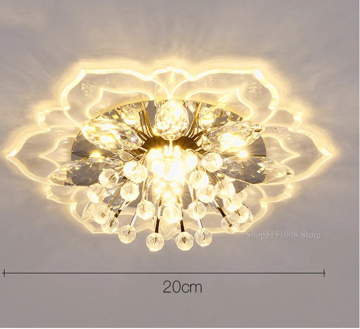 Maison Ornate Crystal Ball Chandelier features colorful flowers and crystal design, casting a floral-patterned glow.