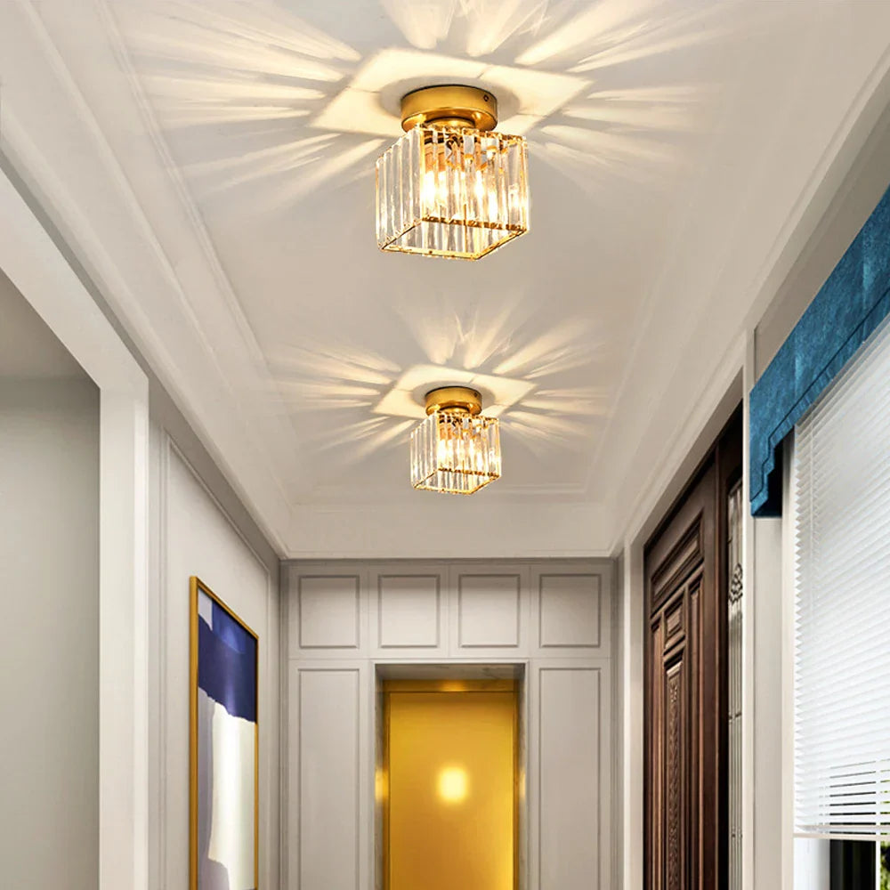 Maison Ornate Crystal Hallway Chandeliers with modern industrial design, casting starburst patterns above.
