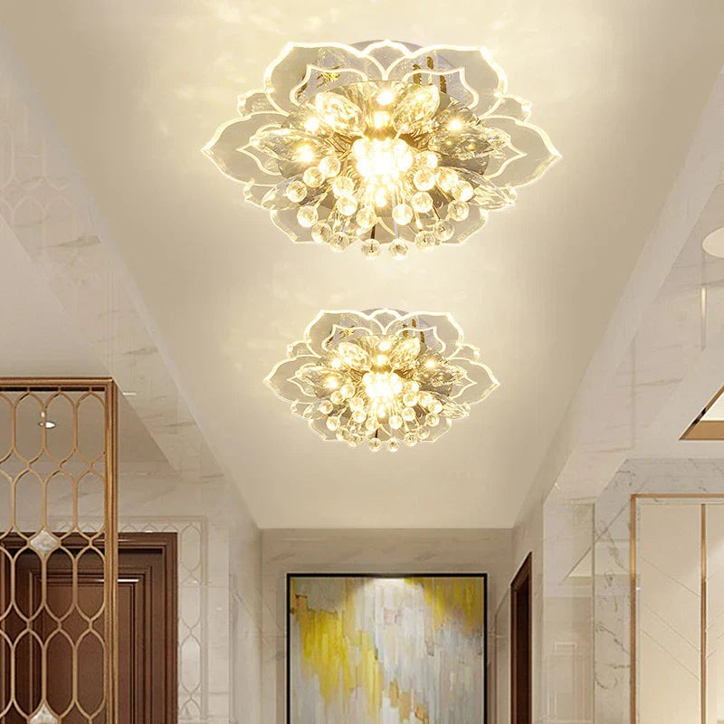 Maison ornate crystal ball chandeliers adorned with colorful flowers, vibrant and elegant indoor lighting fixtures.