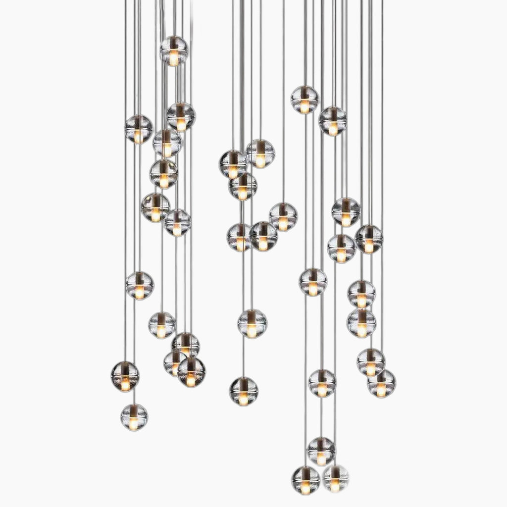Nordic crystal chandelier with clear glass globes at varied heights for modern elegance.