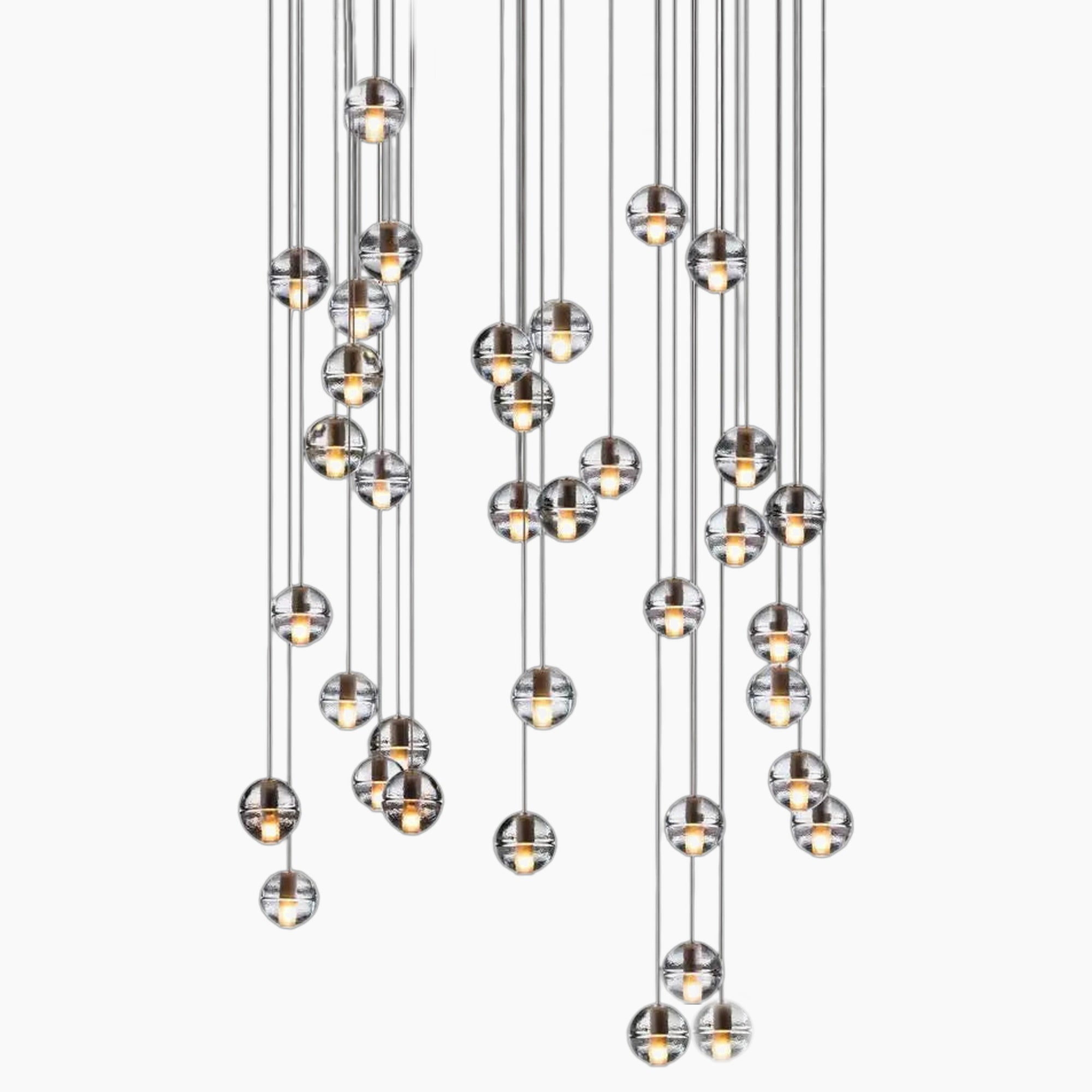 Nordic crystal chandelier with clear glass globes at varied heights for modern elegance.