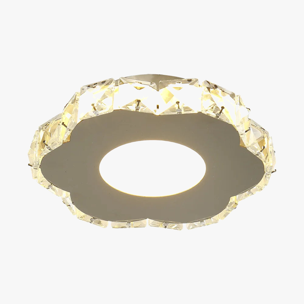 Flower-shaped chandelier with clear faceted crystals and warm LED center, modern and ornate design.