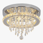 Contemporary crystal LED chandelier with chrome base, double circular tiers, and warm white lighting.