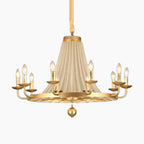 Elegant crystal chandelier with gold accents, beaded curtains, tassels, and eight candle-style bulbs.