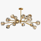Gold-armed postmodern crystal chandelier with faceted glass globes and LED lighting in starburst design.