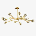 Postmodern crystal chandelier with LED-lit branching arms and faceted glass globes on a central rod.