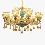Luxurious baroque chandelier with ornate gold details, green-blue accents, teardrop crystals, candle bulbs.