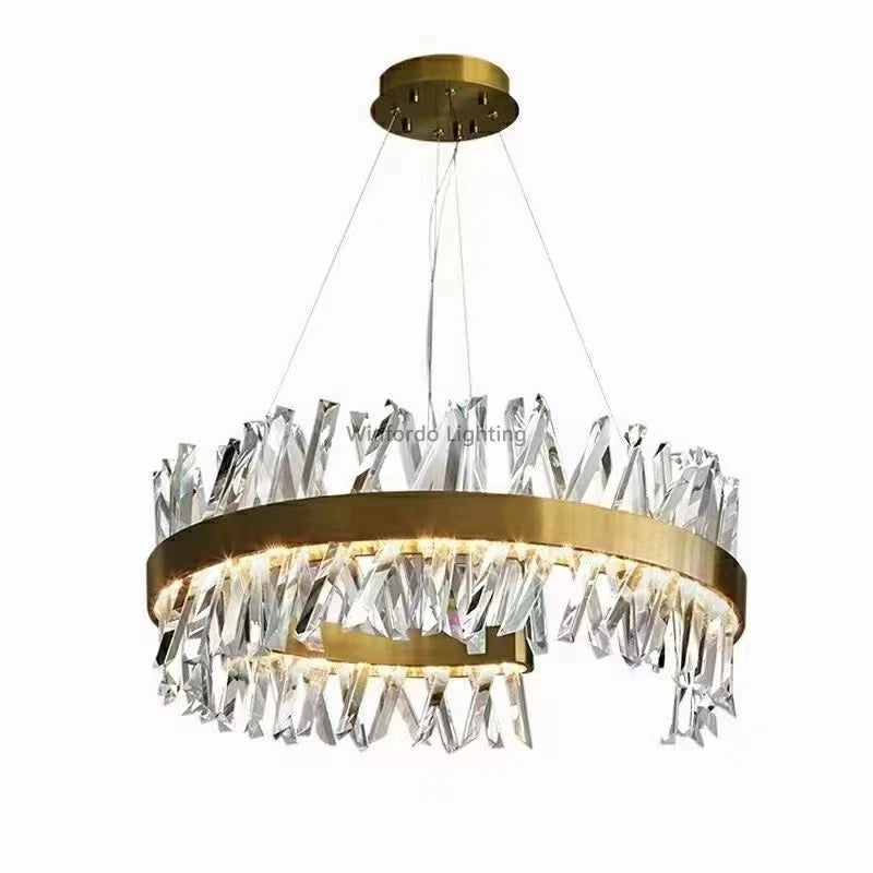 Gold-finished circular chandelier with crystals, wire suspension, and embedded lights for elegant illumination.