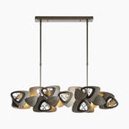Modern stainless steel and glass chandelier with triangular frames, circular glass fixtures, and ambient LED lighting.